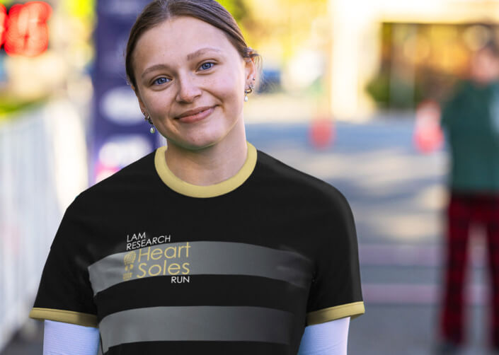 A young Heart & Soles runner wearing the 2025 Race Shirt